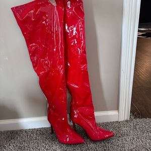 Red latex high heel knee high boots